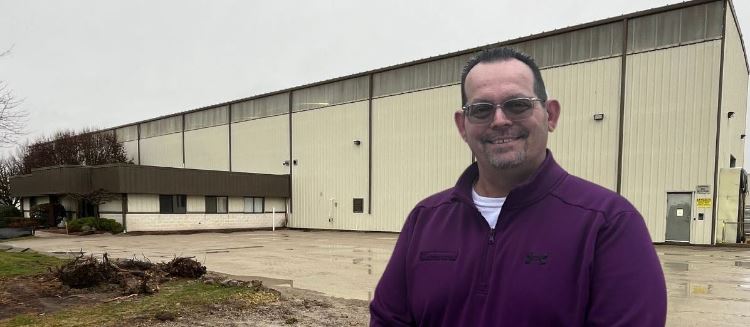 Chad Clark in front of Advanced Heat Treat Corp building expansion December 2024